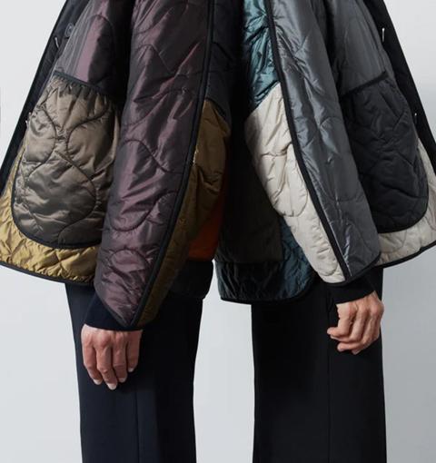 Two models in quilted jackets with patchwork panels