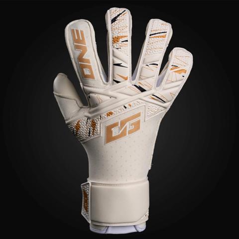 White goalkeeper glove with gold detailing on a black background